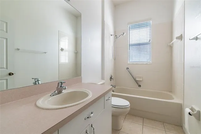 a bathroom with a sink toilet tub and shower