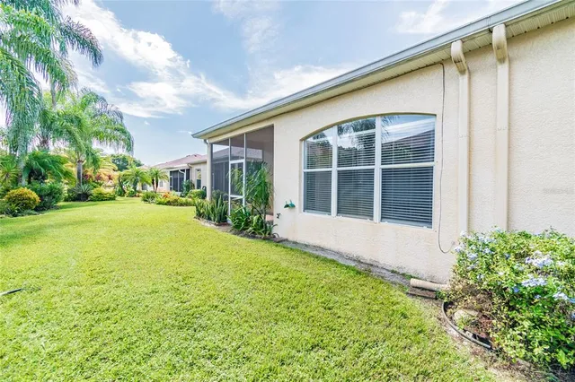 a house view with swimming pool in front of it
