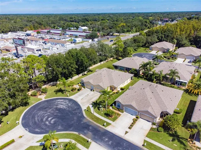 an aerial view of a house with a swimming pool yard and outdoor seating