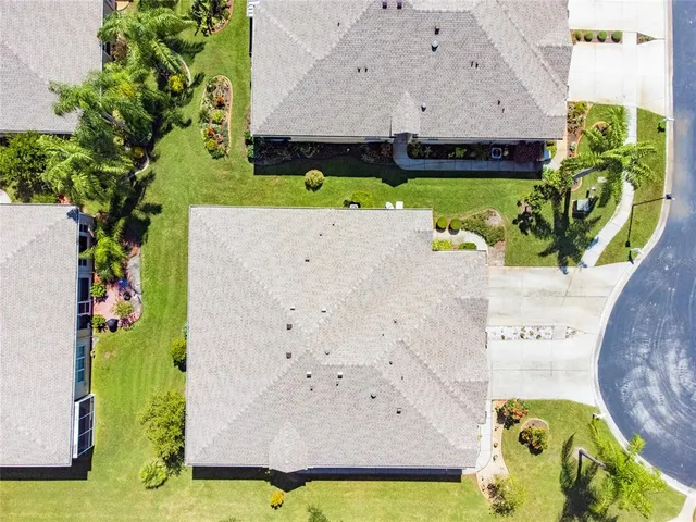 an aerial view of a house with a garden
