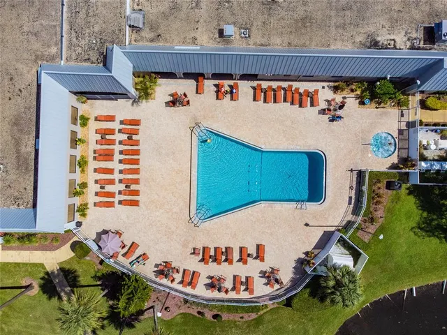 a view of a patio with table and chairs