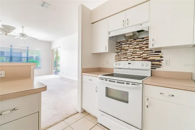 a kitchen with a stove and a microwave