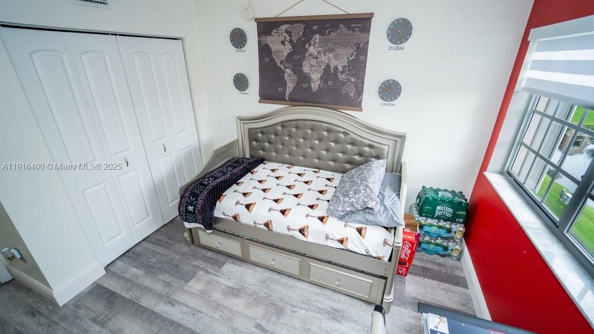 The Enclave at Miramar Miramar, FL 33025 - Photo 11 of 23 a bedroom with a bed and a window