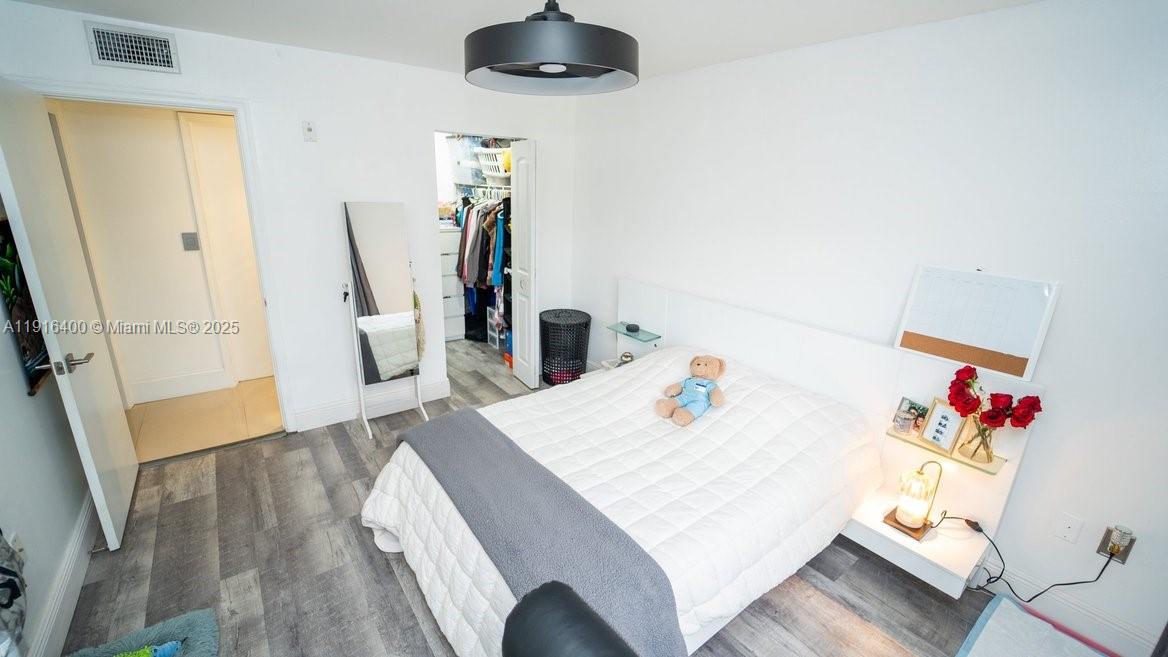 The Enclave at Miramar Miramar, FL 33025 - Photo 13 of 23 a bedroom with a bed and a flat screen tv