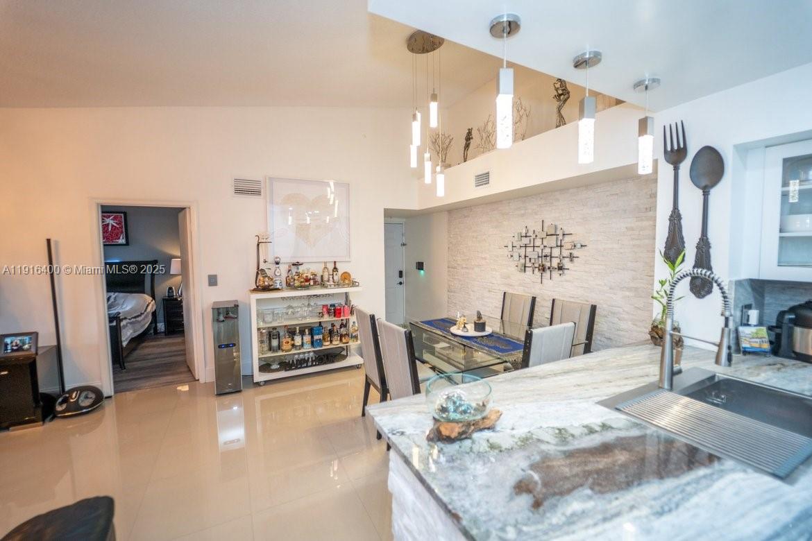 The Enclave at Miramar Miramar, FL 33025 - Photo 16 of 23 a living room with fireplace furniture and a wooden floor