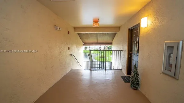a view of empty room with floor to ceiling window