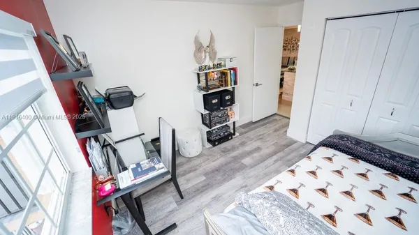 a view of an entryway with wooden floor