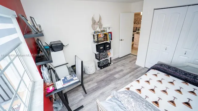a view of an entryway with wooden floor