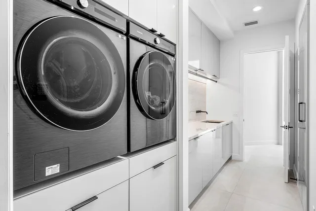 a bedroom with a large bed and a large window