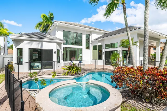 a view of a swimming pool with a patio