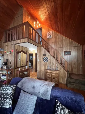 a view of living room kitchen with furniture and wooden floor