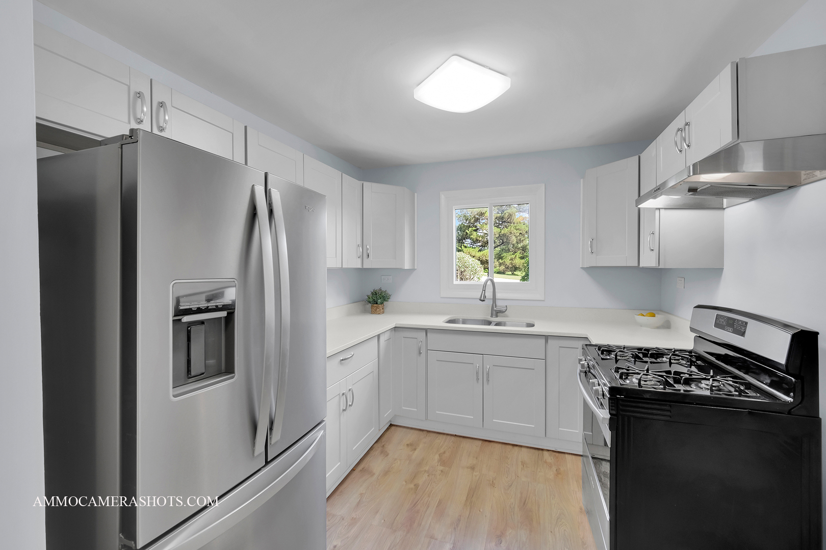 25W375 Plank Road Naperville, IL 60563 - Photo 18 of 47 a kitchen with a refrigerator and a sink