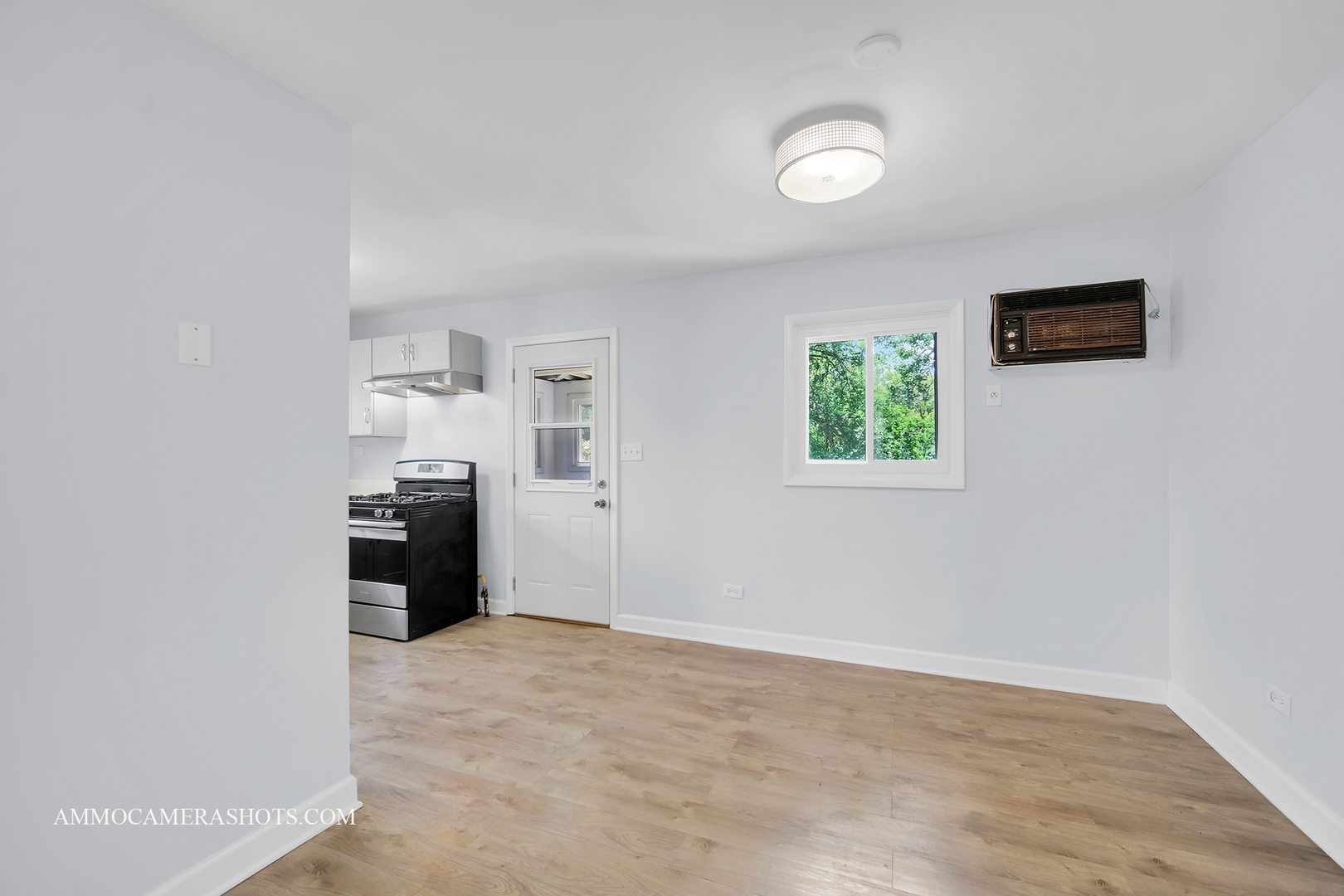 25W375 Plank Road Naperville, IL 60563 - Photo 19 of 47 an empty room with kitchen view and a window