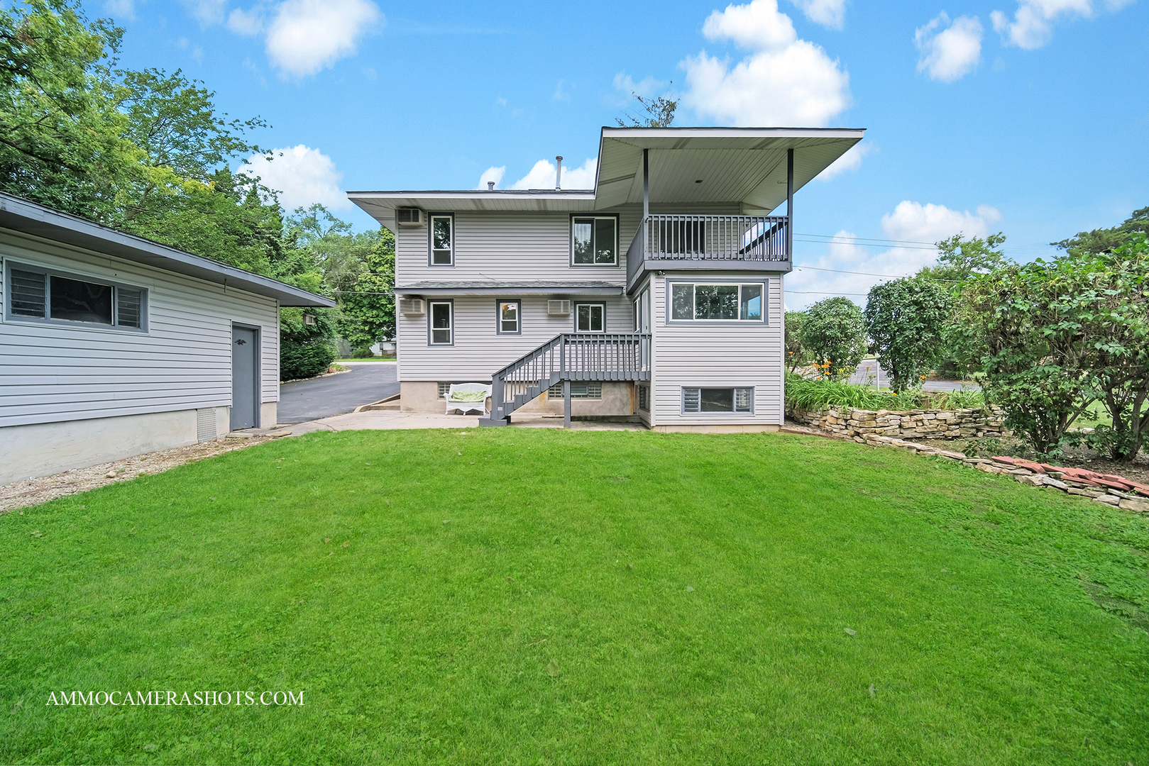 25W375 Plank Road Naperville, IL 60563 - Photo 9 of 47 a view of a house with a yard and sitting area