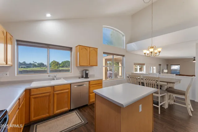 a kitchen with a stove a counter top space and stainless steel appliances