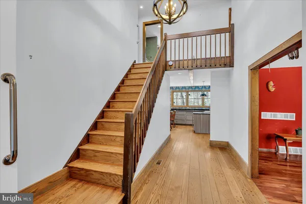 a view of an entryway with wooden floor