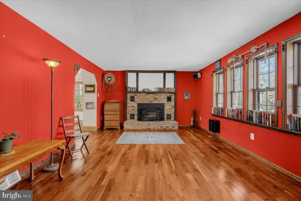 a living room with furniture fireplace and flat screen tv