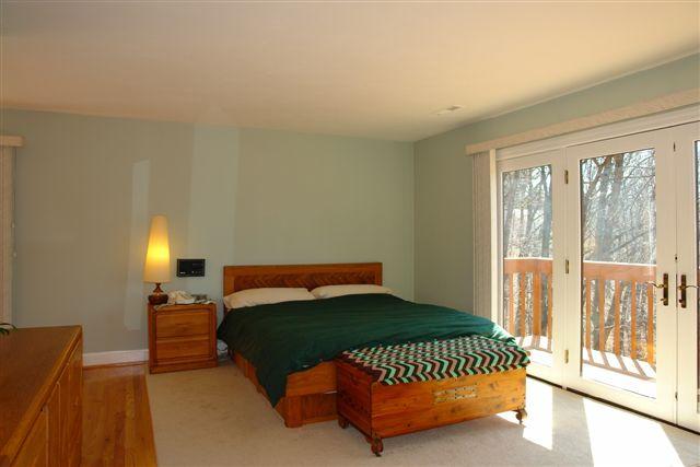 5212 Falcon Ridge Road Roanoke, VA 24018 - Photo 6 of 10 a bedroom with a bed and a lamp with window