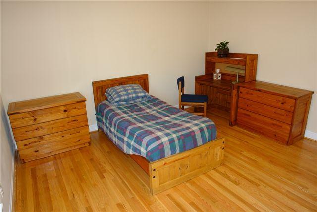5212 Falcon Ridge Road Roanoke, VA 24018 - Photo 8 of 10 a bedroom with a bed and wooden floor