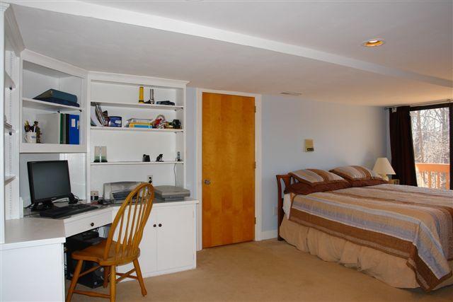 5212 Falcon Ridge Road Roanoke, VA 24018 - Photo 9 of 10 a bedroom with a bed and a tv in it