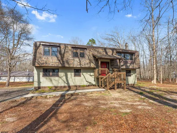 a view of a house with wooden deck
