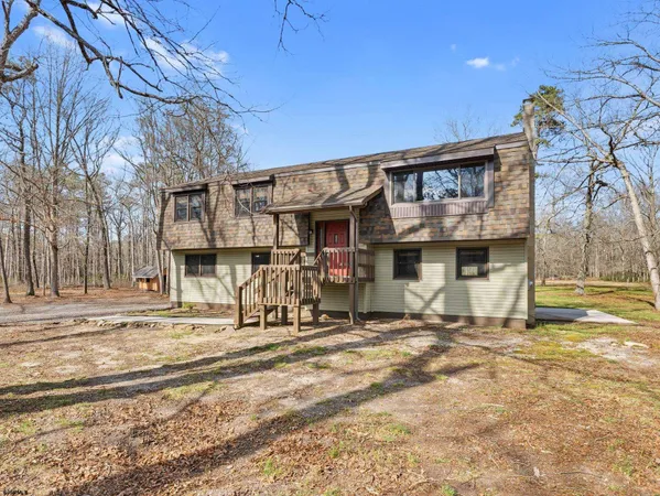 a view of a brick house with a wooden door