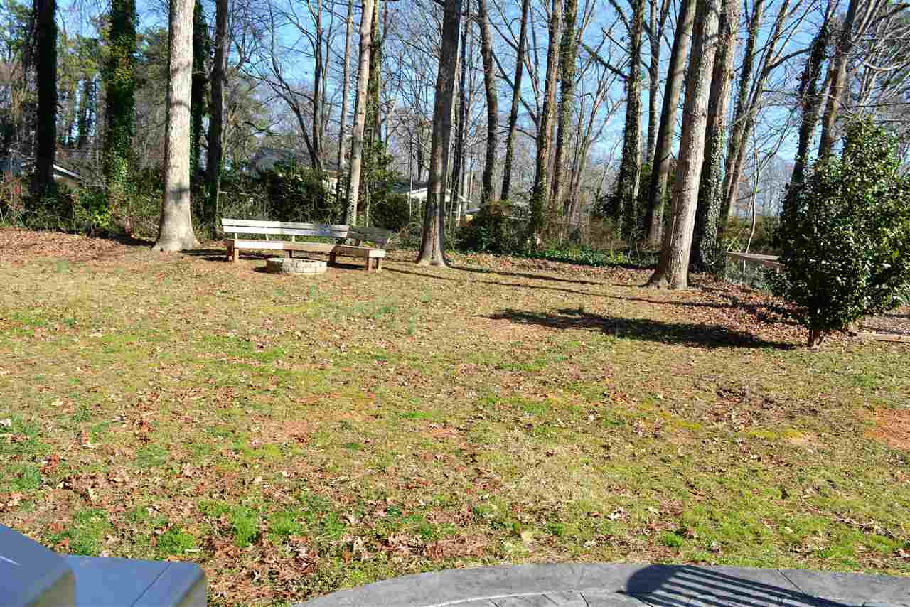 204 Winterlochen Road Raleigh, NC 27603 - Photo 21 of 28 Wooded backdrop provides privacy!