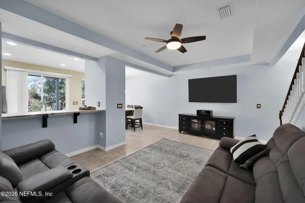 a dining room with furniture and window