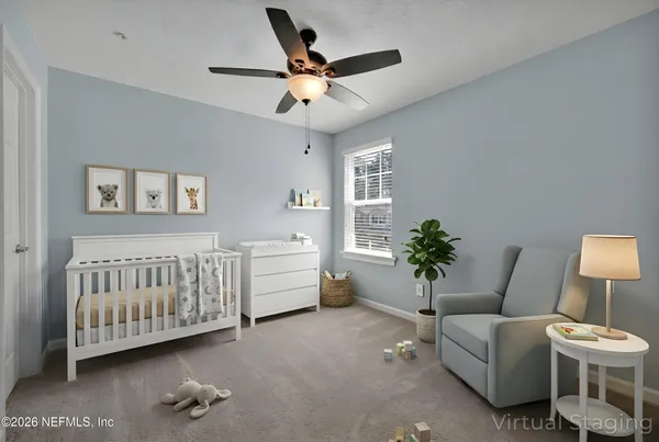 a bedroom with bed and a window