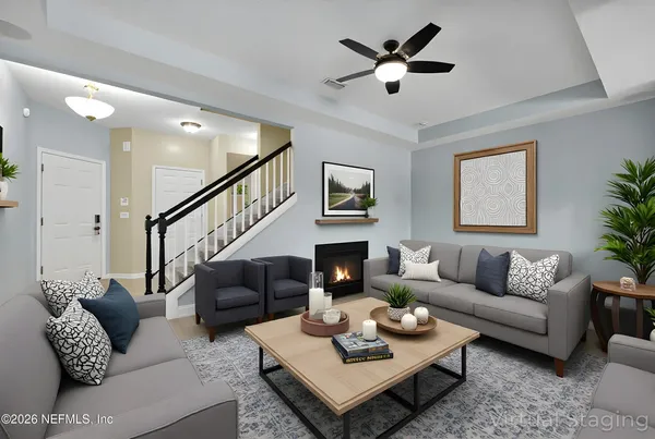a living room with furniture and a flat screen tv