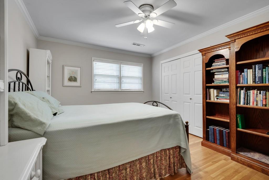 1440 Diamond Head Circle Decatur, GA 30033 - Photo 26 of 35 a room with a bed and a book shelf