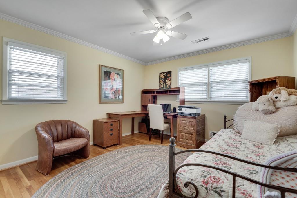 1440 Diamond Head Circle Decatur, GA 30033 - Photo 27 of 35 a bedroom with furniture and a chandelier