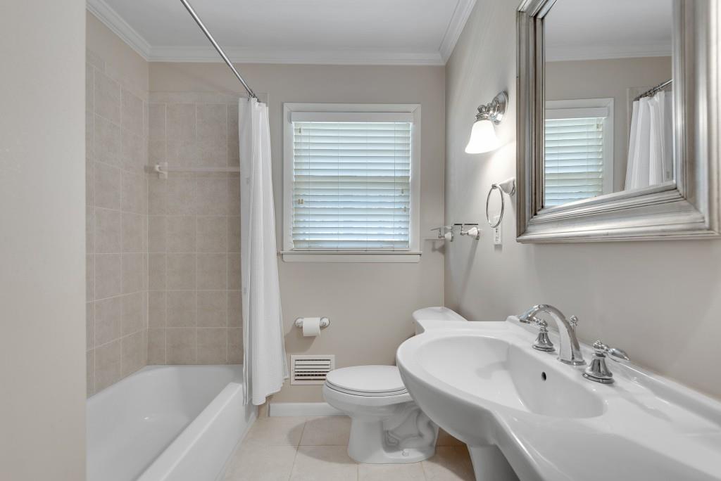 1440 Diamond Head Circle Decatur, GA 30033 - Photo 28 of 35 a bathroom with a sink toilet and shower