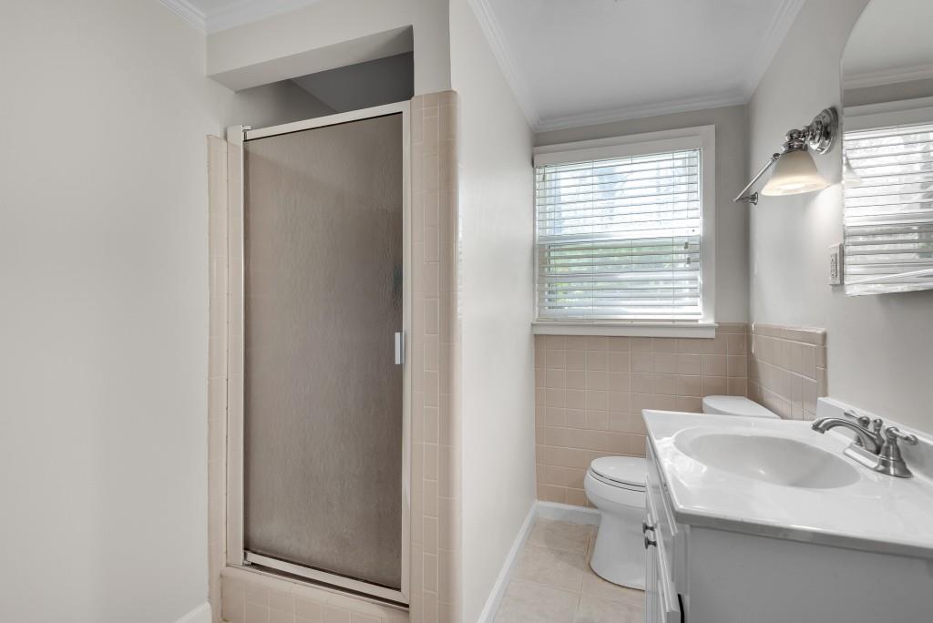 1440 Diamond Head Circle Decatur, GA 30033 - Photo 29 of 35 a bathroom with a sink toilet and a mirror