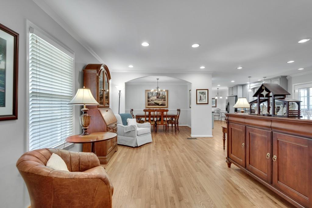 1440 Diamond Head Circle Decatur, GA 30033 - Photo 4 of 35 a living room with furniture kitchen view and a wooden floor