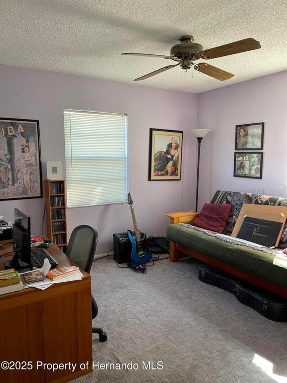 6233 Hancock Avenue Spring Hill, FL 34608 - Photo 8 of 19 a living room with furniture and a window