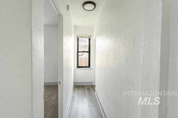 622 West Commercial Street Weiser, ID 83672 - Photo 13 of 21 Hallway featuring a textured wall and light wood-style floors
