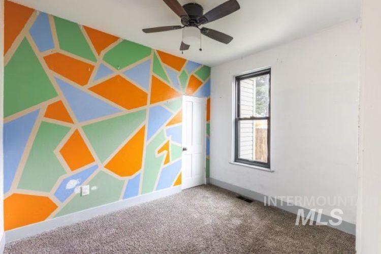 622 West Commercial Street Weiser, ID 83672 - Photo 14 of 21 Carpeted spare room with a ceiling fan and baseboards