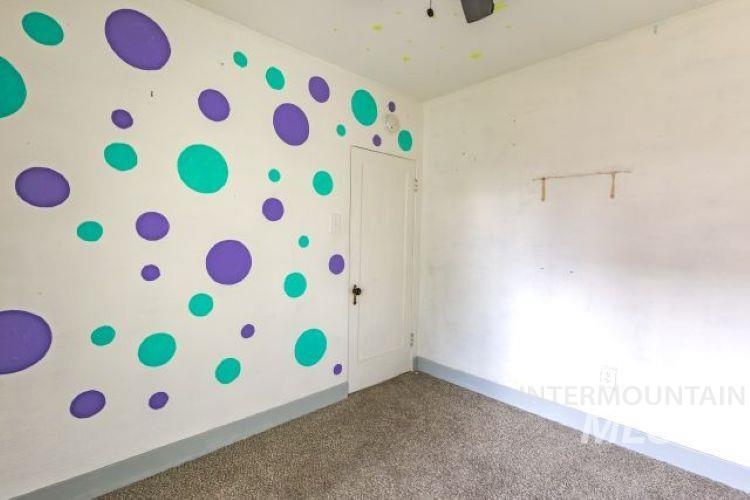 622 West Commercial Street Weiser, ID 83672 - Photo 15 of 21 Spare room with carpet floors and a ceiling fan