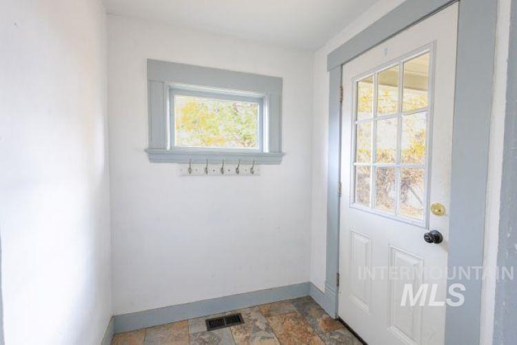 622 West Commercial Street Weiser, ID 83672 - Photo 3 of 21 Entryway with baseboards and stone finish flooring