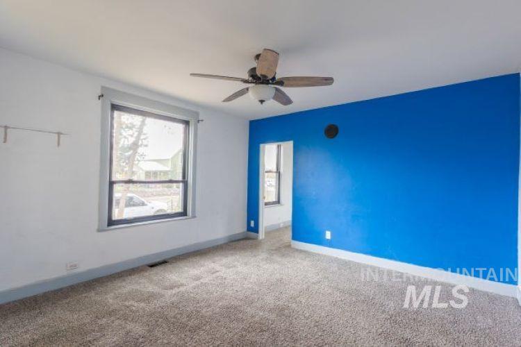 622 West Commercial Street Weiser, ID 83672 - Photo 4 of 21 Unfurnished room featuring carpet floors and ceiling fan