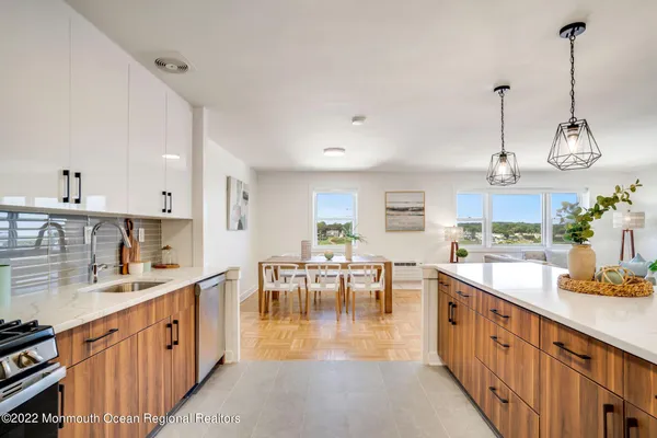 a bedroom with a bed and a table in it next to a window