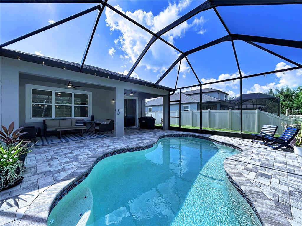 18078 Romanesque Court Spring Hill, FL 34610 - Photo 64 of 81 a view of a backyard with furniture and tub