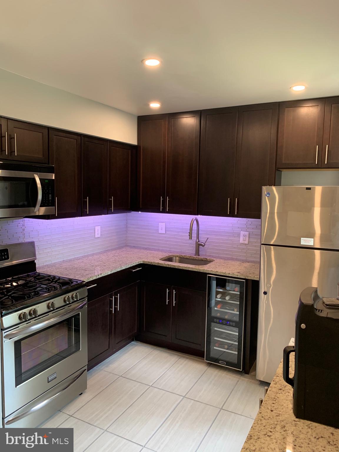 9647 White Acre Road, Unit B4 Columbia, MD 21045 - Photo 2 of 19 Upgraded Kitchen w/ Stainless Steel Appliances