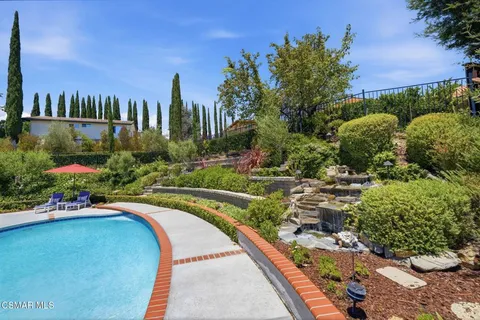 a view of a swimming pool with a garden