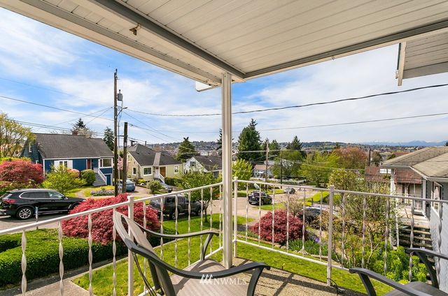 a view of balcony with furniture
