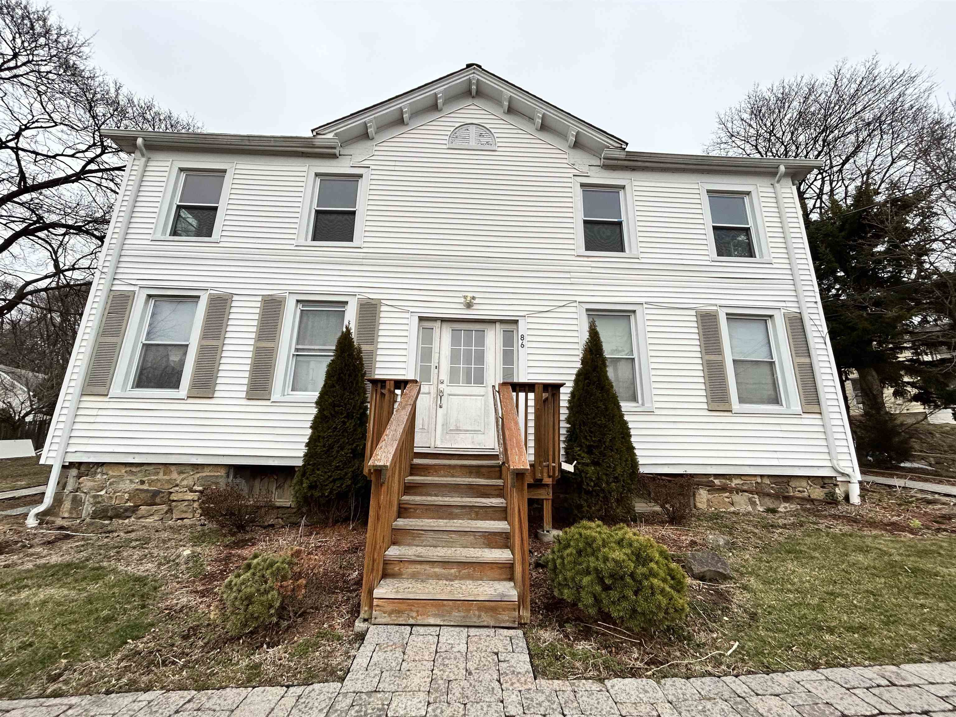 86 South Morris Street, Unit B Dover, NJ 07801 - Photo 1 of 11 a front view of a house with a yard