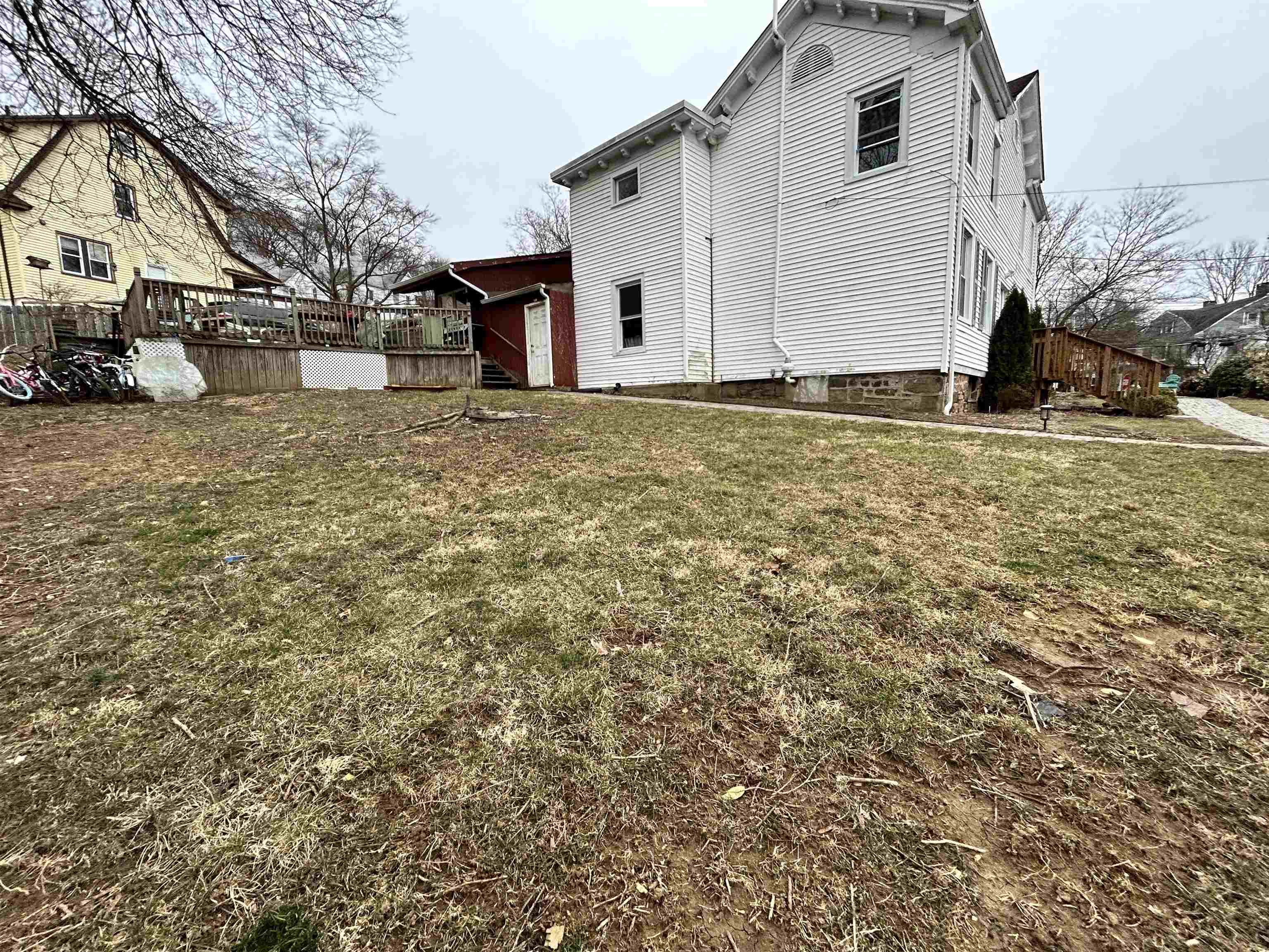 86 South Morris Street, Unit B Dover, NJ 07801 - Photo 2 of 11 a white house that has a tree in front of it