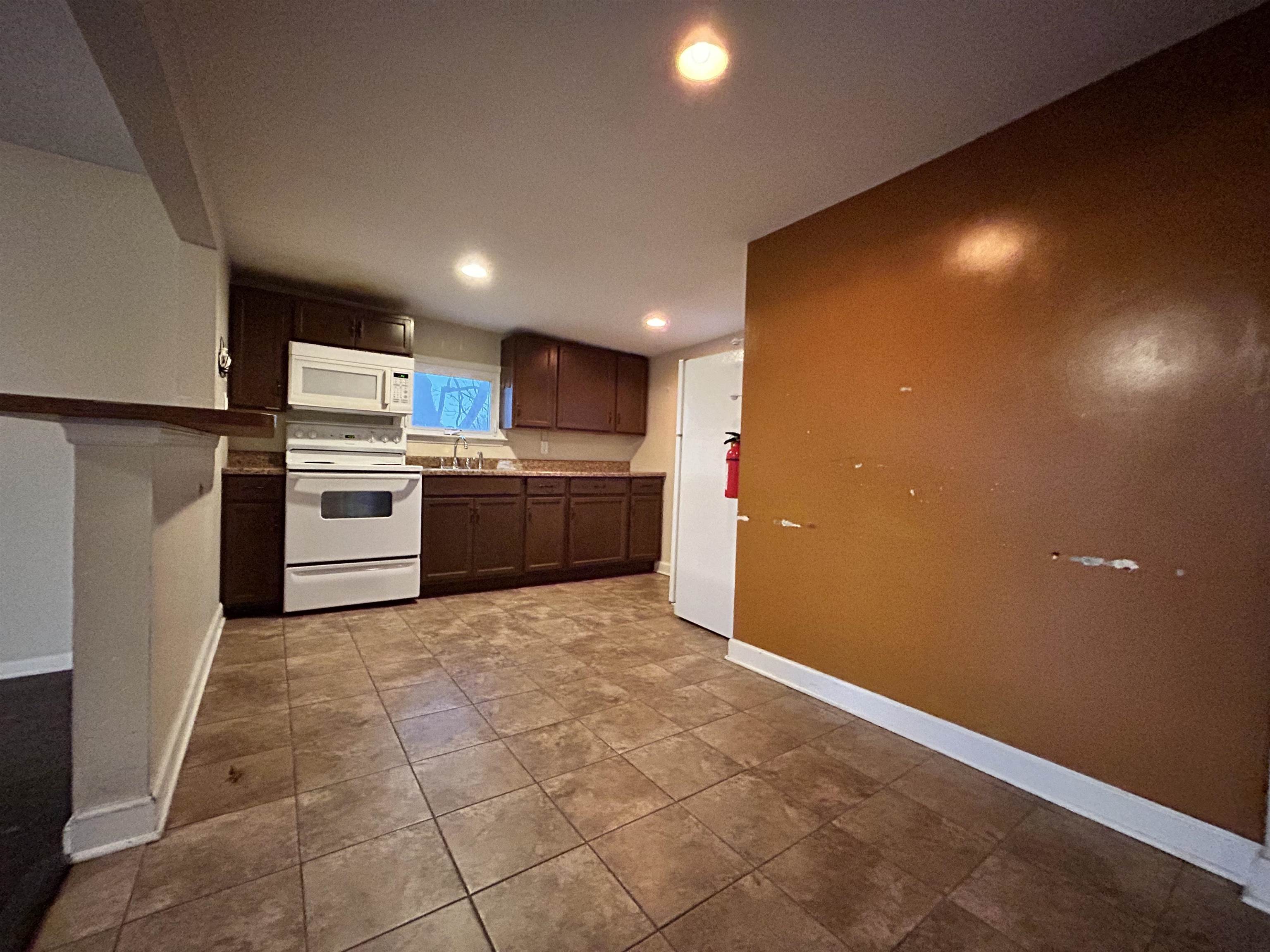 86 South Morris Street, Unit B Dover, NJ 07801 - Photo 4 of 11 a kitchen with refrigerator and microwave