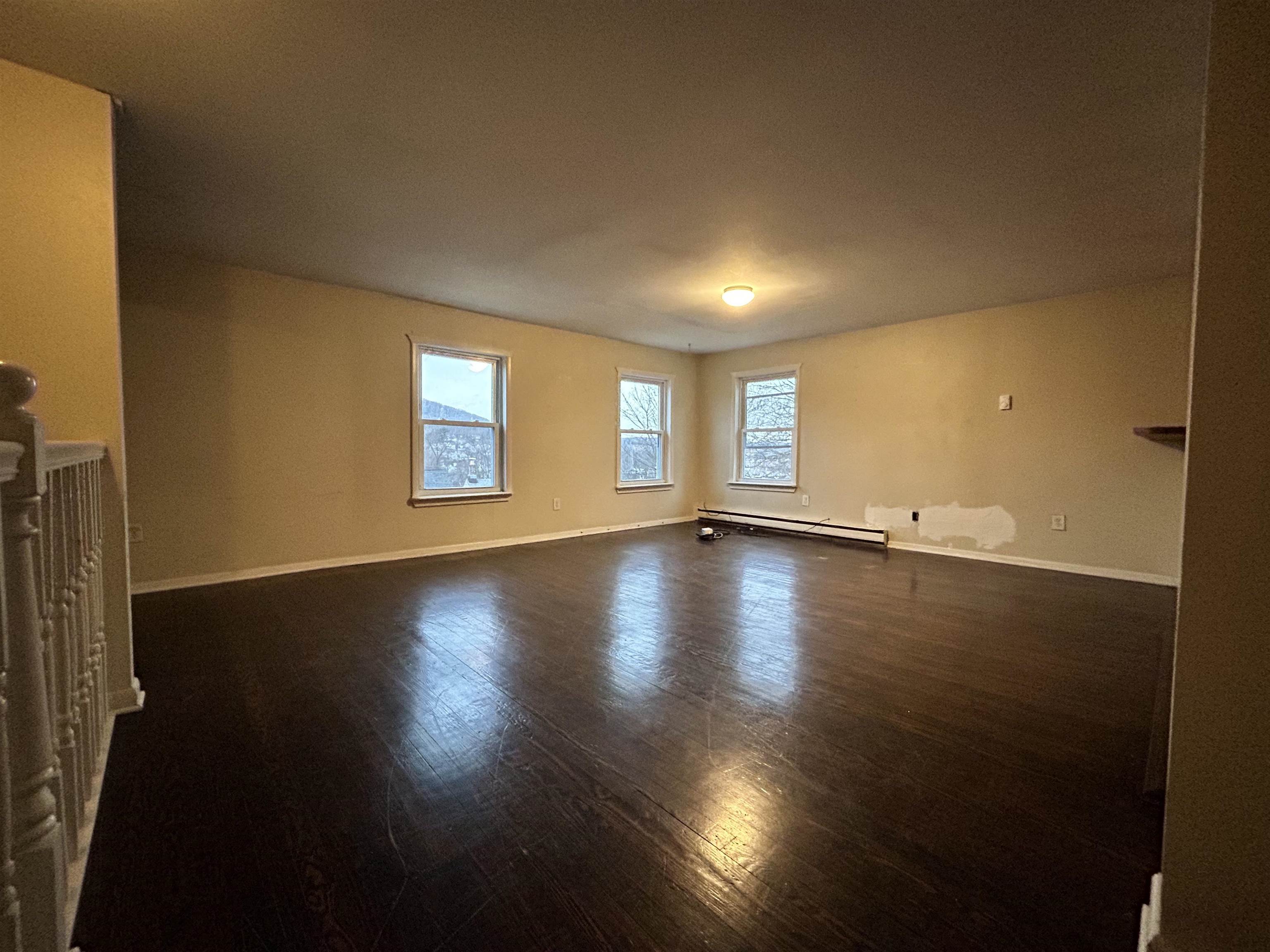 86 South Morris Street, Unit B Dover, NJ 07801 - Photo 6 of 11 a view of empty room with wooden floor and fan